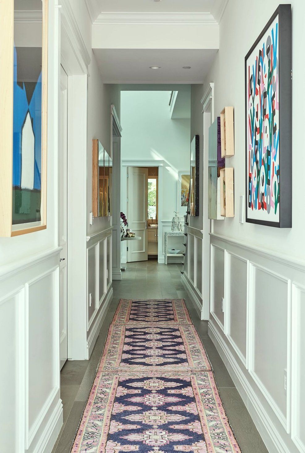 Annette_Tatum_Encino - long hallway - Oriental rug - wainscoting