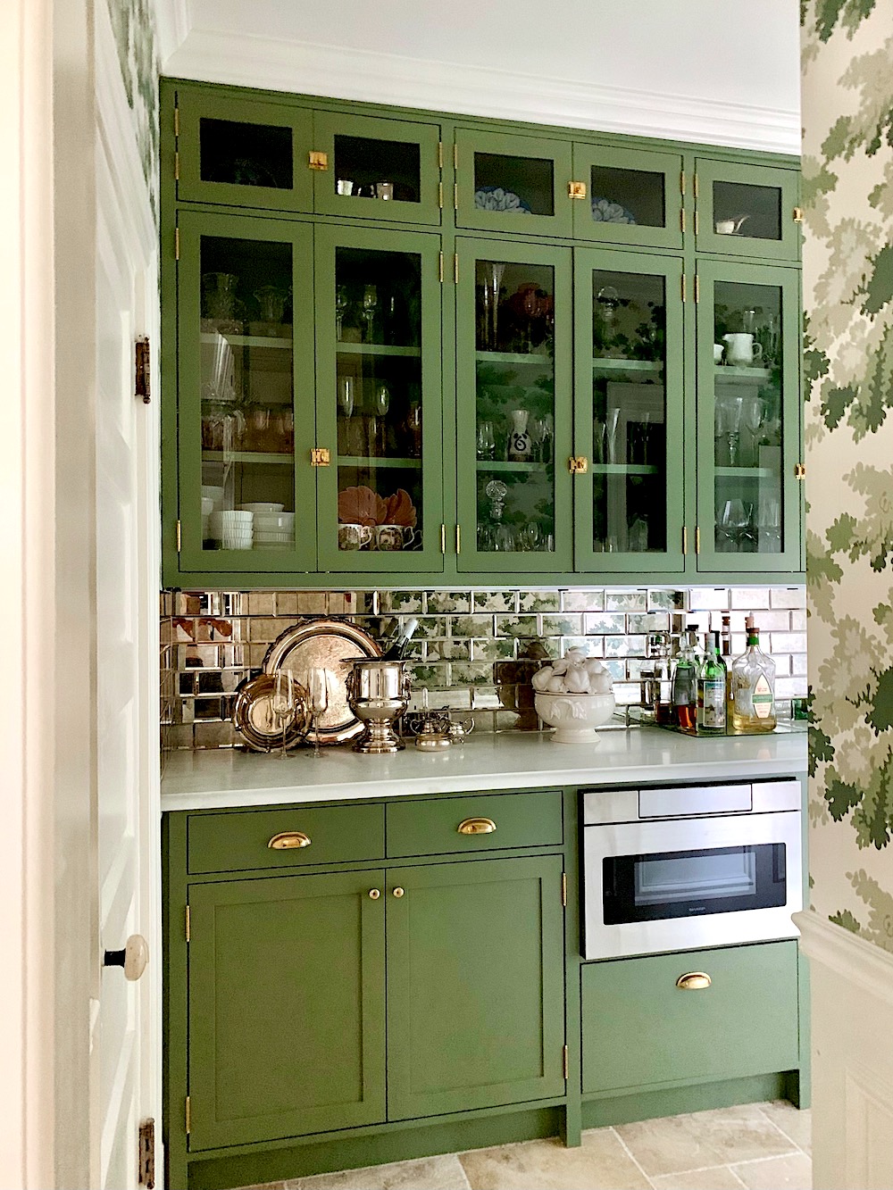 Farrow & Ball Calke Green cabinets - antique mirror subway tile