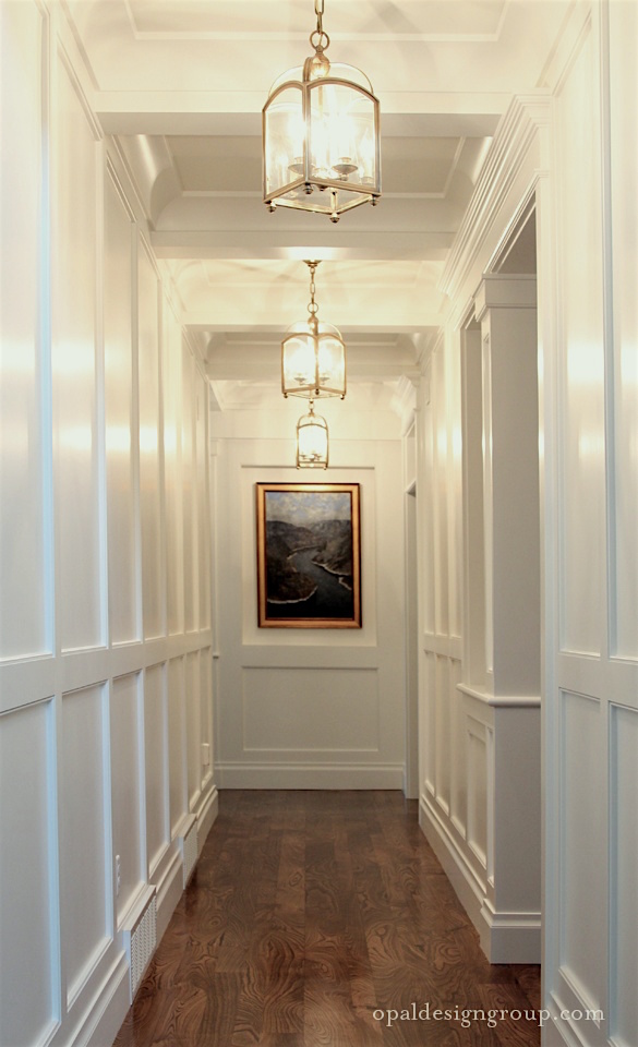 opal-design-group-wainscoting-hall-coffered-ceiling-brass-pendant-lanterns-white-gloss-paint