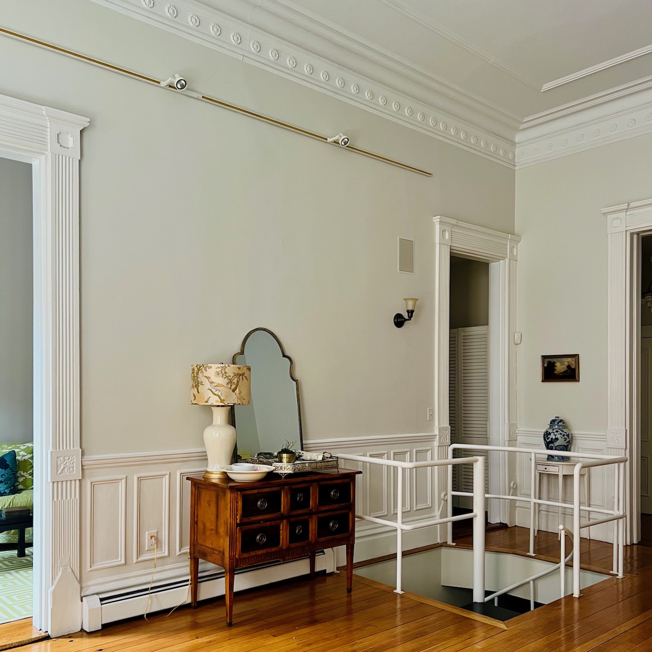 Spiral Staircase juts into the living room - Milling Road chest