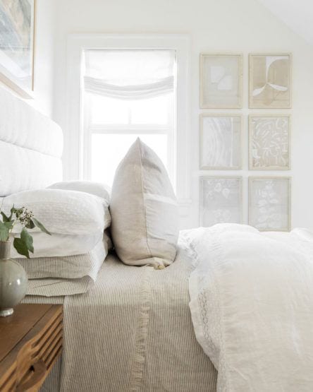 studio mcgee_bedroom with abstract art wall