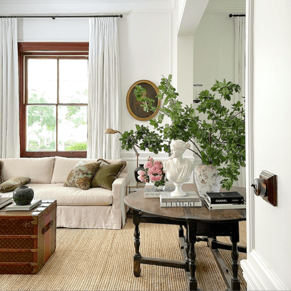 Best neutral color scheme - white walls - Steve Cordony - Rosedale Farm Living room - blooming branches - Louis Vuitton Steamer Trunk