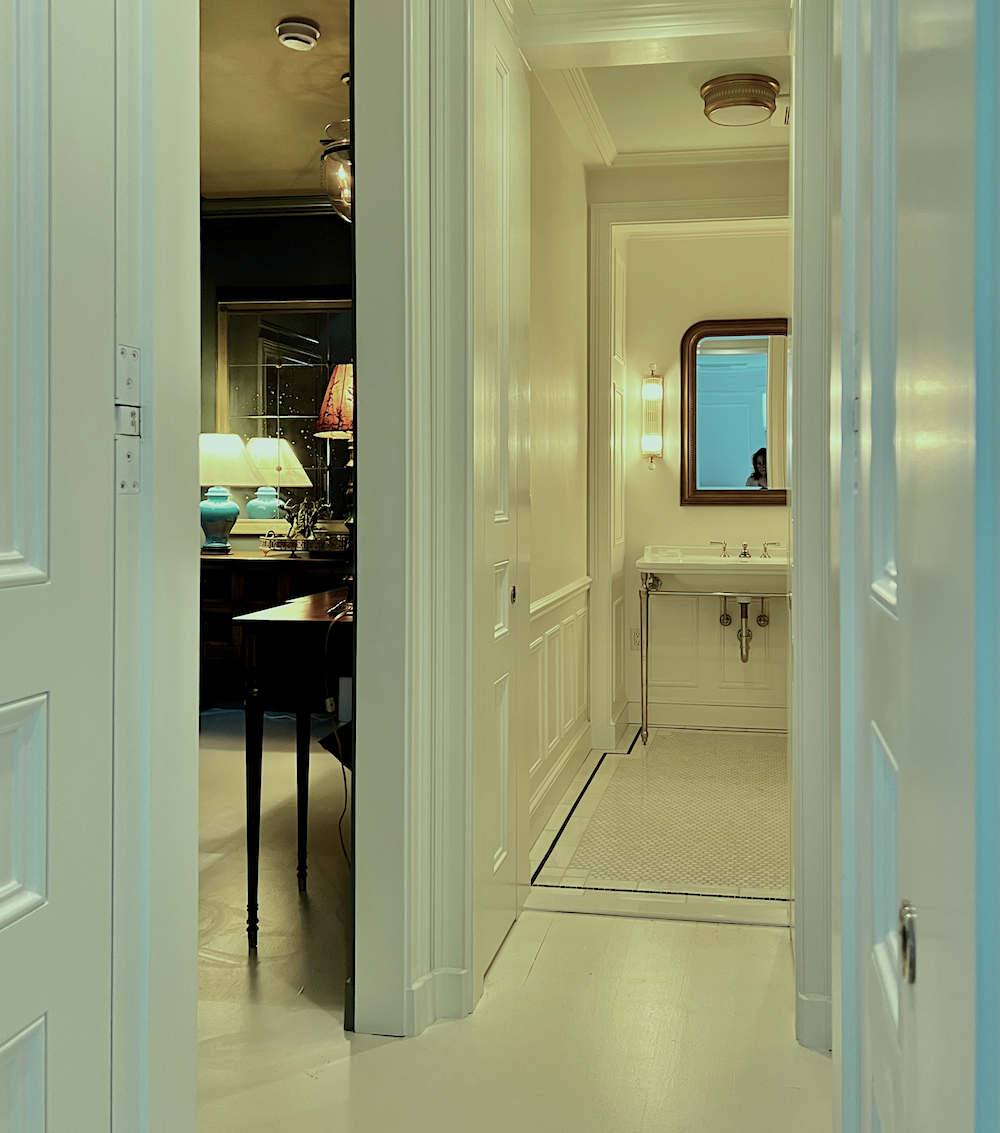 embrasure hall looking into primary bathroom and garden level entry